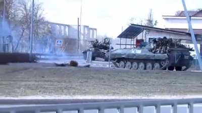 Russian military aiming at civilians who are filming them