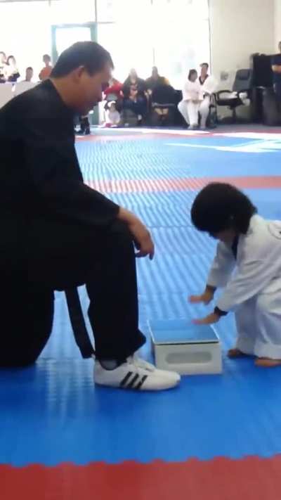 Kid tries to break boards!