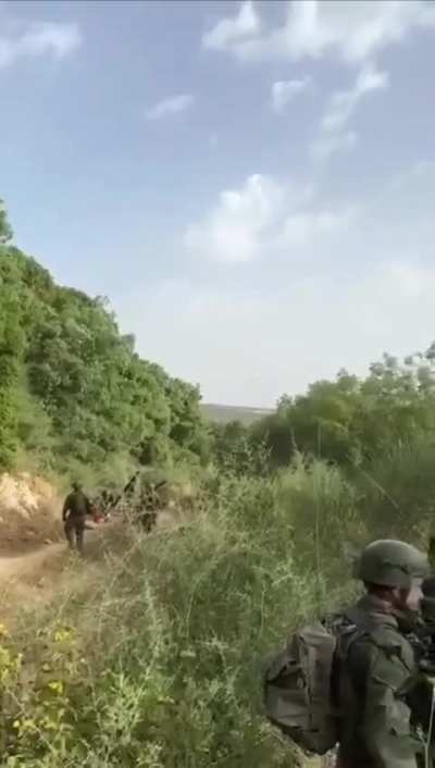 IDF fires oil bottles from a mortar to light the shrubbery on fire