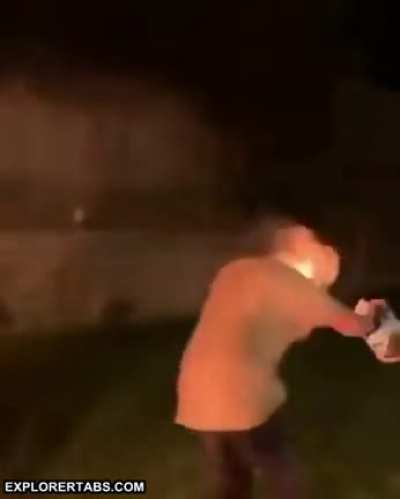 Spitting accelerant point blank into a fire