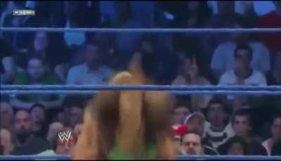 Beth Phoenix laying out AJ Lee with the Glam Slam 