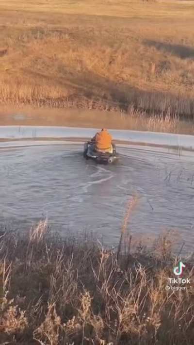 Crossing a river on an ATV