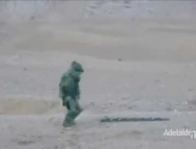 Guy dancing in an EOD suit after defusing training bomb