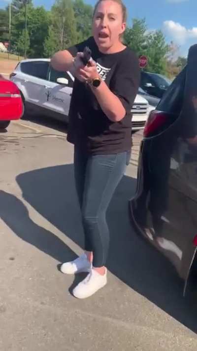 So this is America.... This is a mother of three in Michigan getting a gun pulled on her for walking behind a van in the parking lot. Her daughters are standing right next to her. Please make this go viral so this lady can’t harass anymore innocent people