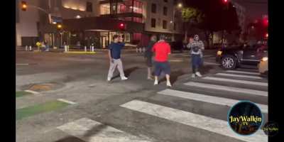2 guys fighting outside liquor store with bats & sticks