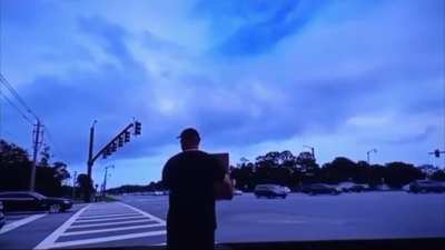 “Concerned citizens” keep calling the cops on a man holding a sign that says “Eat a Bag of D**ks”