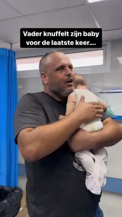 Palestinian father hugs his baby for the last time - NSFW