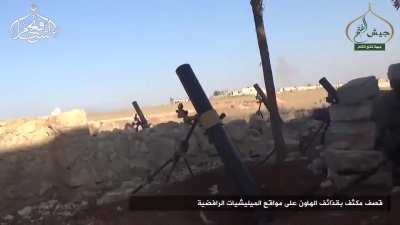 Drone footage of Jabhat Fatah al Sham shelling regime armored vehicles with mortars near the Artillery Faculty in Southern Aleppo. August 24th, 2016.