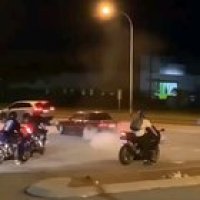 Burning your tires right where the police is driving past
