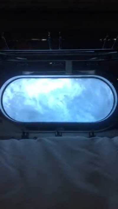 Where can I get a live wallpaper of waves crashing on the screen somewhat like that porthole view?
