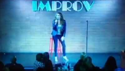 Female 'comedian' collapses on stage after joking about taking the vaccine, ends up with a fractured skull, audience laughs and thinks it's part of the act.