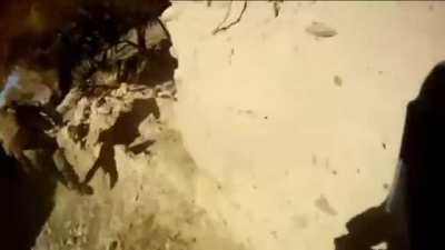 Australian infantry in an intense firefight at close range with a large group of Taliban. They engage the enemy with hand grenades.