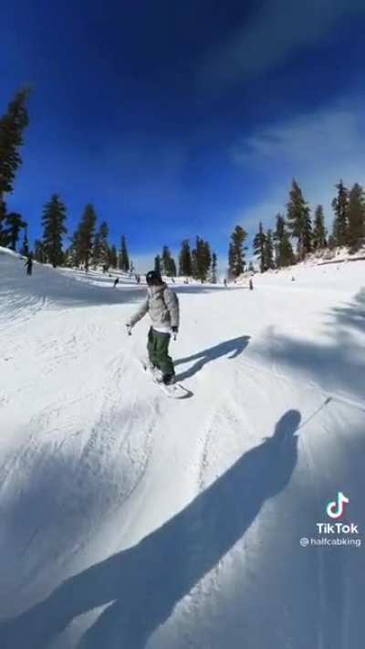 Helping out a first time snowboarder