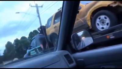 Guy takes his truck back off of a moving tow truck