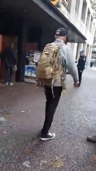 Vancouver Police shove man to ground then immediately go after the person recording it