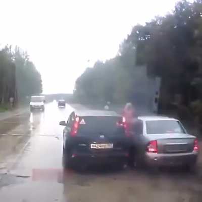 Men stops car in the middle of the road