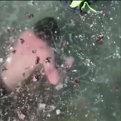 Cameraman records person almost drowning and doesn't help at all