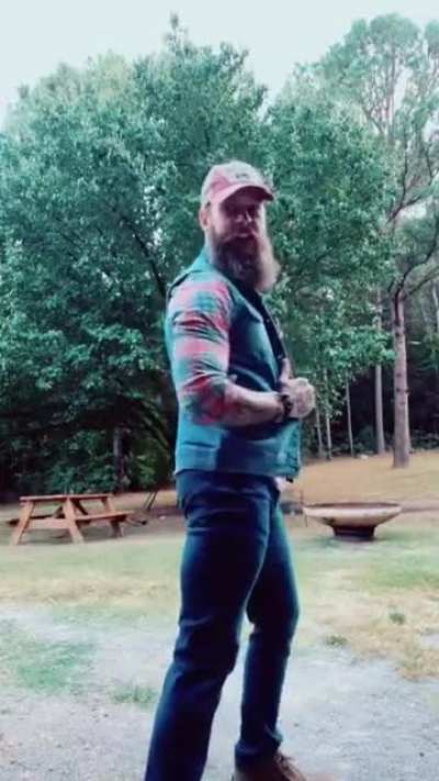 Modeling his denim vest