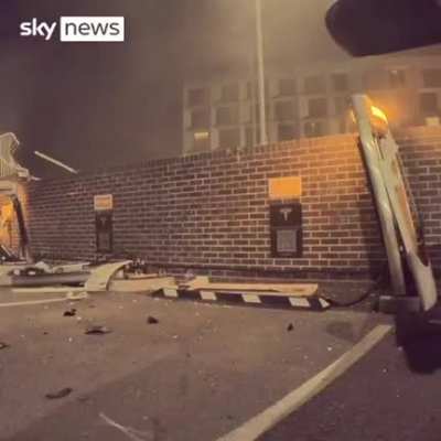 22 August 2022 (London) - A Range Rover crashes through barriers into a Tesla charging station