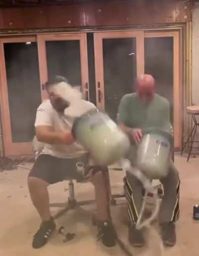 Two men smoke massive bong