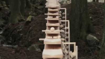Enormous xylophone in the woods of Kyushu, Japan plays a Bach tune when a wooden ball rolls down each 
