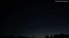 Chain of Elon Musk’s Starlink satellites moving across the sky in Western Europe