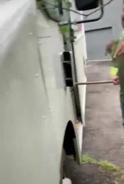 FedEx driver drives on freshly seeded grass
