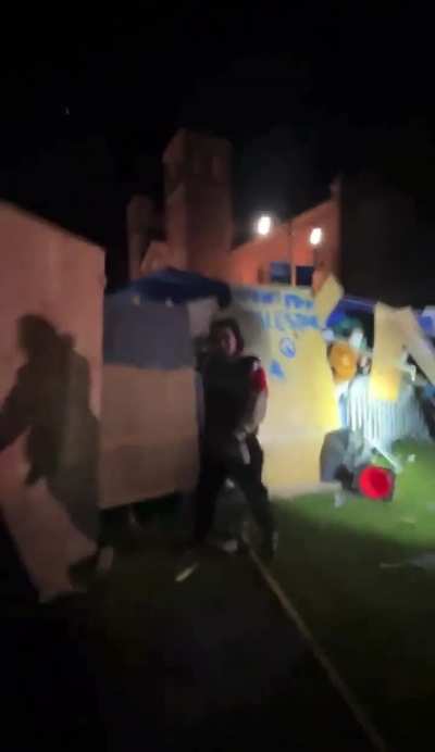 Dozens of Zionists pull a UCLA protestor trying to protect others from the encampment and viciously beat him