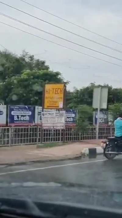 Car slams into a college brawl, one dude bounces off its windshield, gets up and proceeds to continue to brawl. New Delhi, India