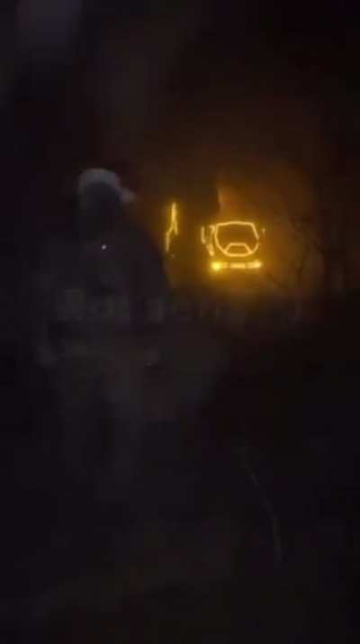 HIMARS covered in Christmas Lights launches at night (music by source)