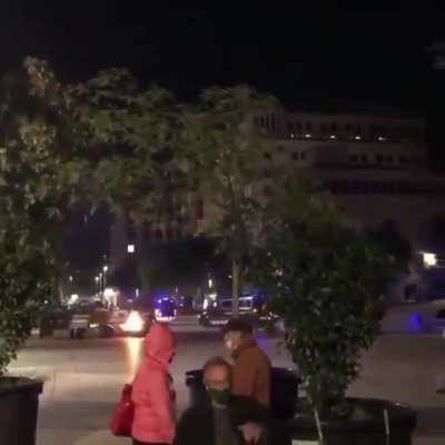 In the middle of the chaos, a man playing the piano