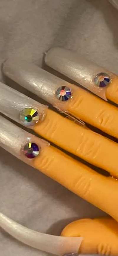 Idk where to post this but I ordered from nailedbymissy keychains on tiktok..omg look what I was sent wrong color, design, they’re literally just nail tips not even filed, glue all over, and it was $47 for 2. She won’t give me a refund or send right item.