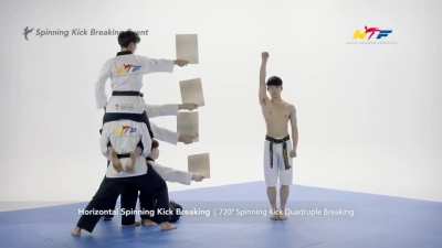 Guy breaks 4 boards in one jump