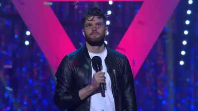 Comedian has a confetti cannon on stage and gives an audience member the button to set it off when he feels it's the right time during the set. It's the best timing ever.