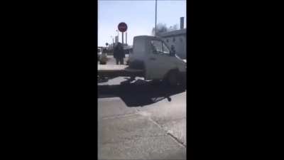 Guy tries to hit police officers, then proceeds to hit another car