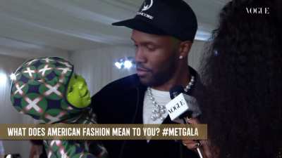 Frank at the Met Gala with a robot baby