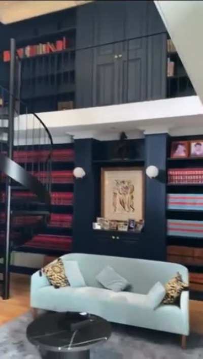 This library behind a painting