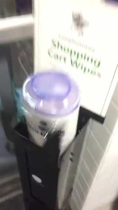 Attempting to refill the wet wipe dispenser at work