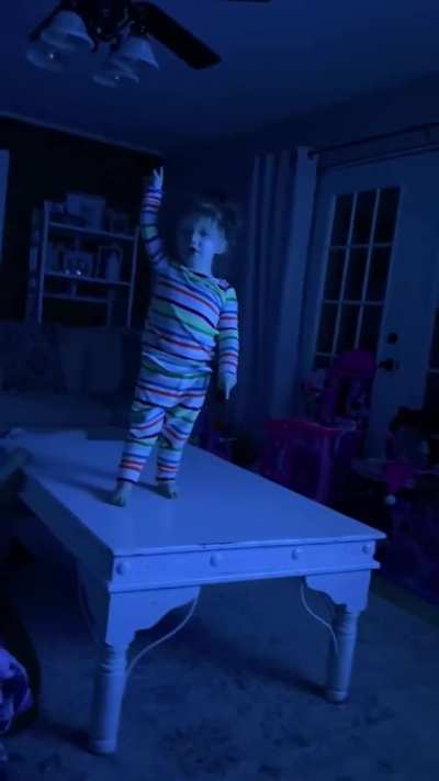 Toddler stops what she's doing when Roman Reign's music hits and makes sure to acknowledge him. 