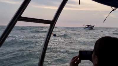 Boat capsized off Kuala Selangor, Malaysia. Captain was rescued from the water, passengers were transferred to another boat before it sank.