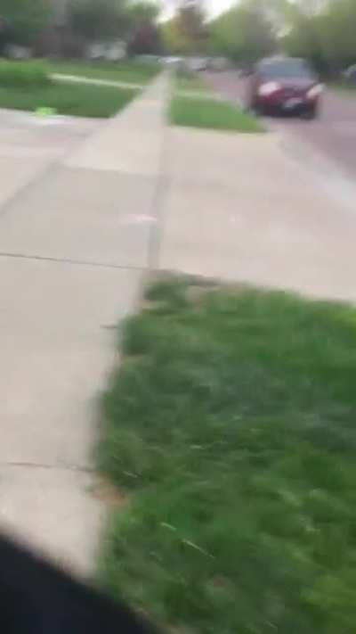 Kid draws among us character on his driveway.