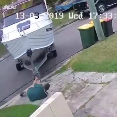 Man pulls his boat all the way to his truck