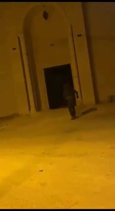 Israeli soldier throws a stun grenade inside a Mosque during prayer is being held. Location: West Bank