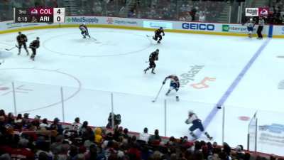 Cale Makar running over a Coyote