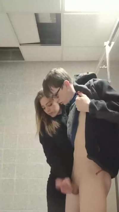 Cheerleader helping out the nerd