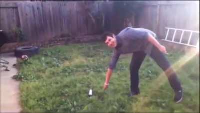 Throwing a knife at a can of spray paint