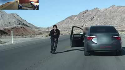 Man Points Finger Guns At American Cops, TWICE