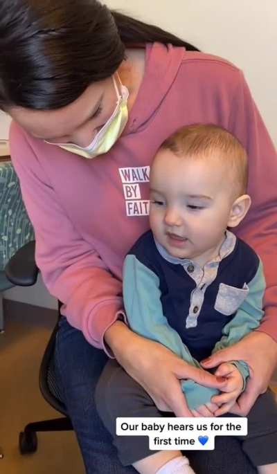 Kid hearing for the first time, instantly switching from crying to a real big grin