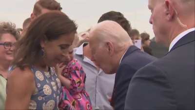Biden attempts to eat a child? 😖