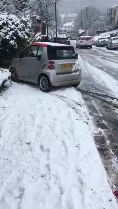 WGCW overtaking a car on a steep hill that's covered in snow?